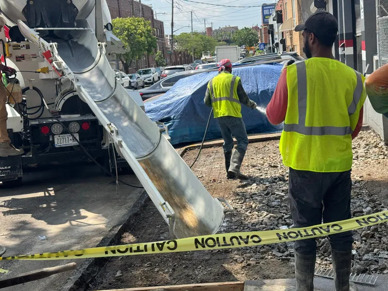 Concrete sidewalk and curb work at a Bronx construction site
