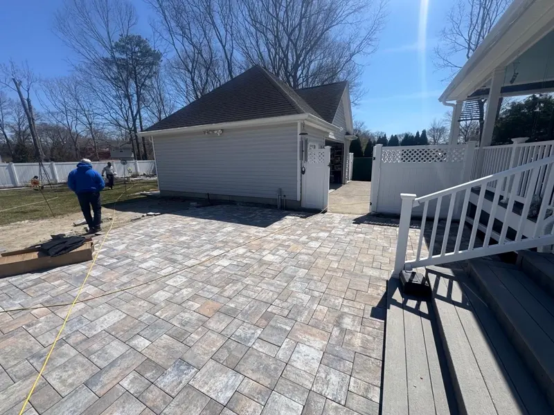 Completed paver patio installation at a Nassau County residence